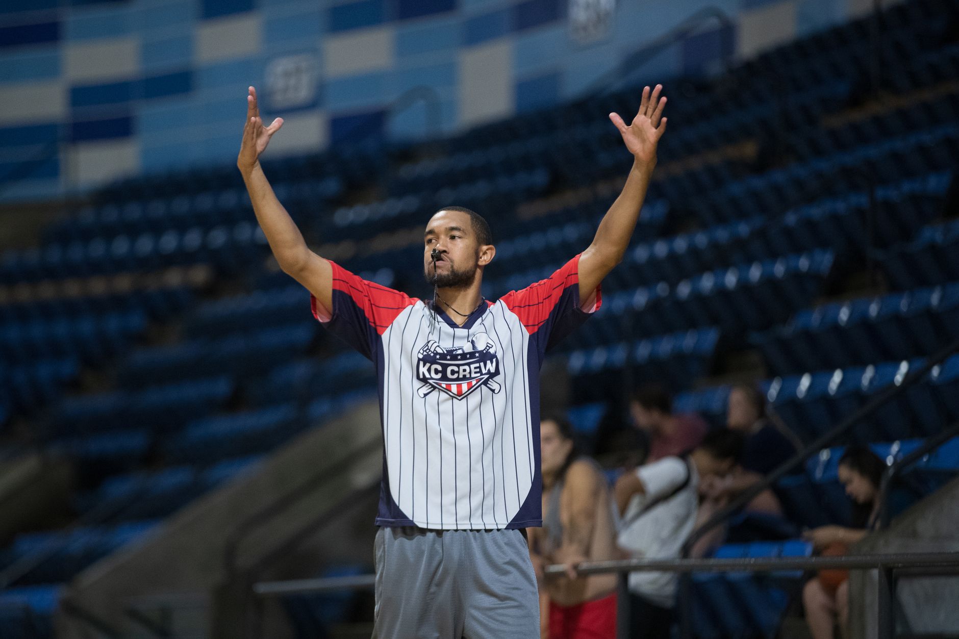 basketball players competing under the hoop