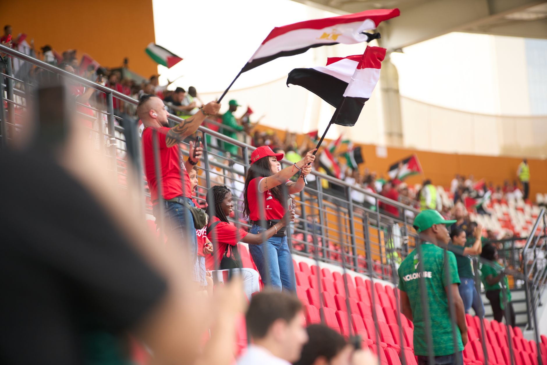 Football stadium packed with fans during a night match