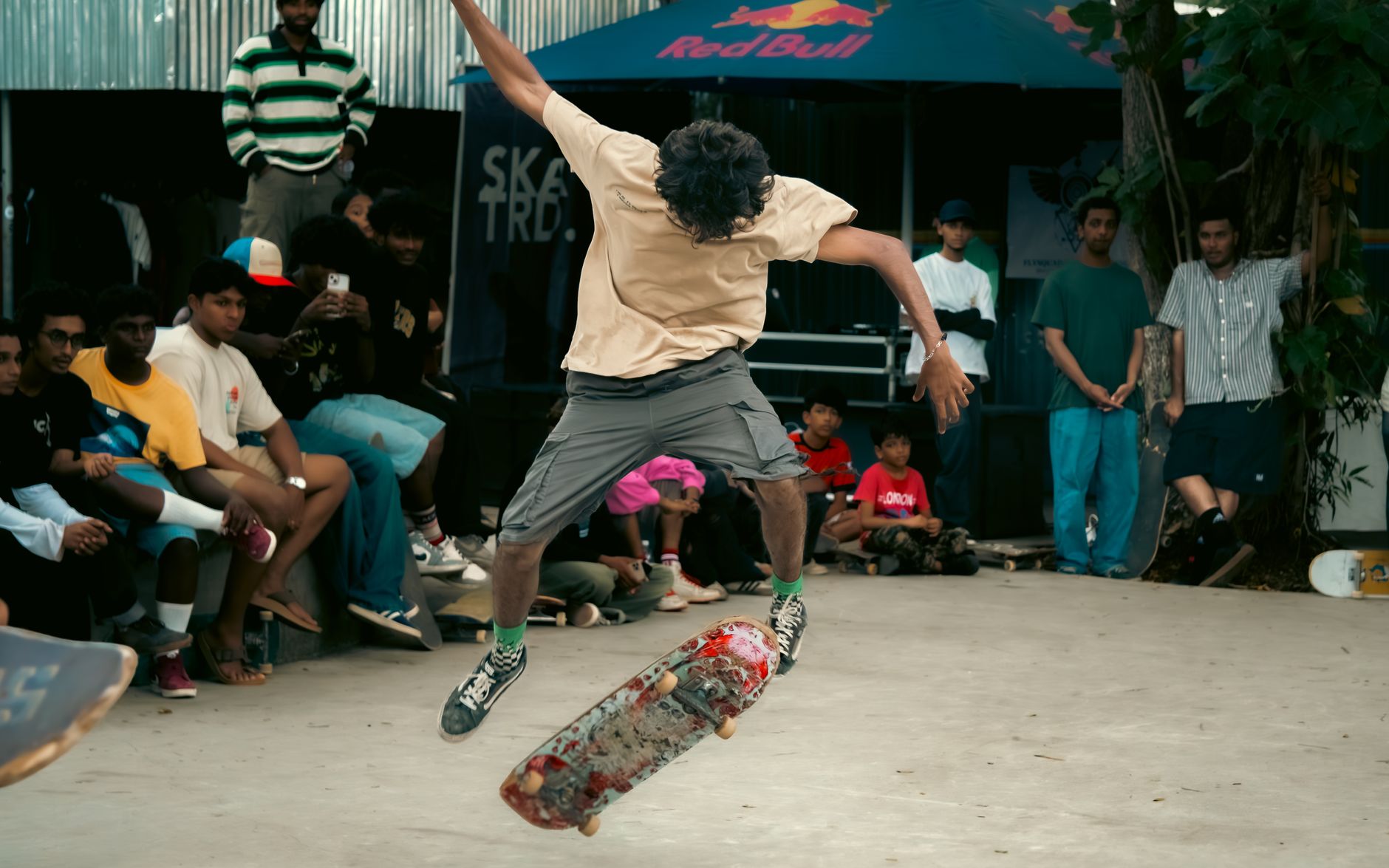 Skateboarder performing a trick on a street-style Olympic course