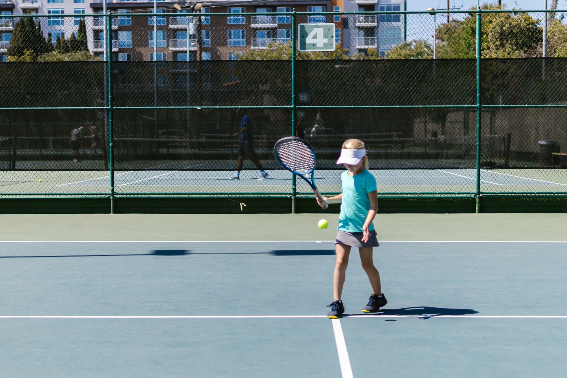 Tennis players competing on clay court